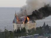 A building close to the seafront has caught fire in Odesa after a reported Russian missile attack. (AP PHOTO)